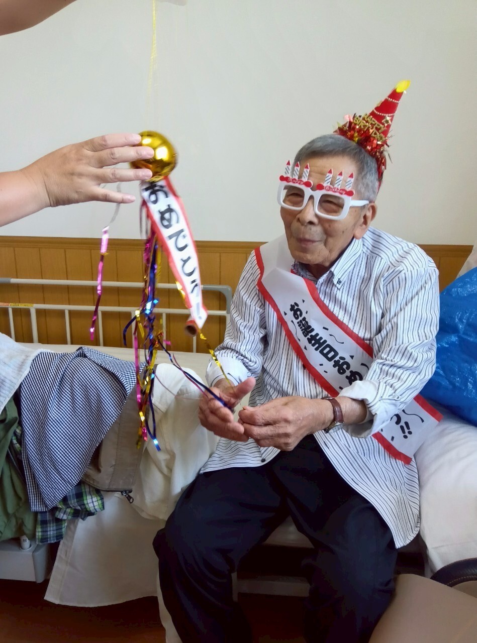 写真：利用者様とスタッフ