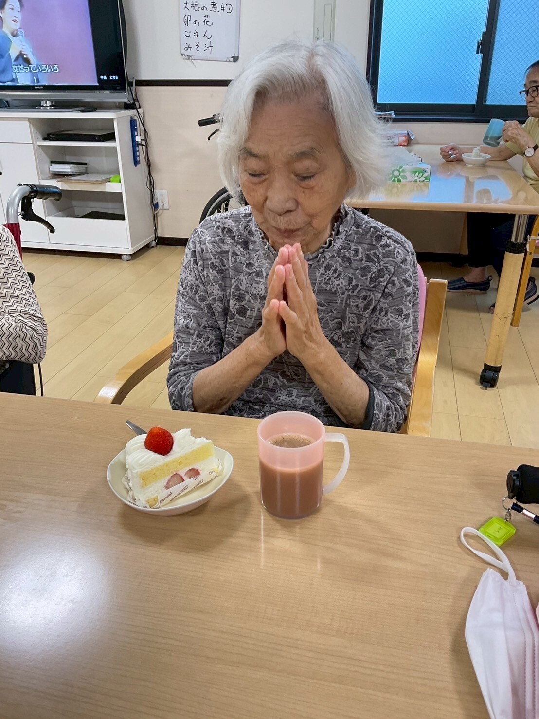 写真：利用者様とスタッフ