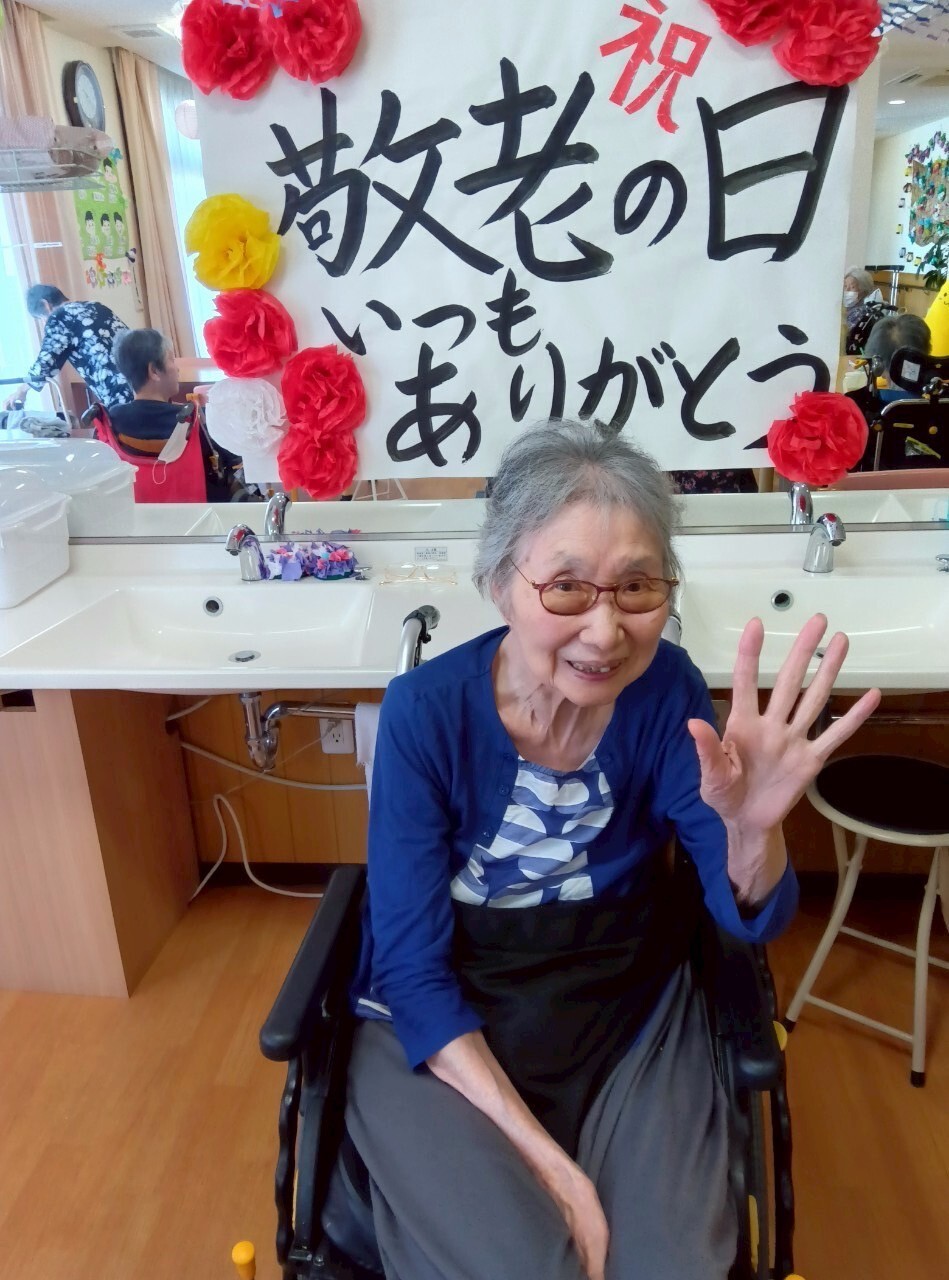 写真：利用者様とスタッフ